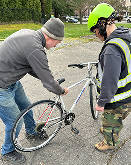 A Full Cycle recipient receiving their new bike