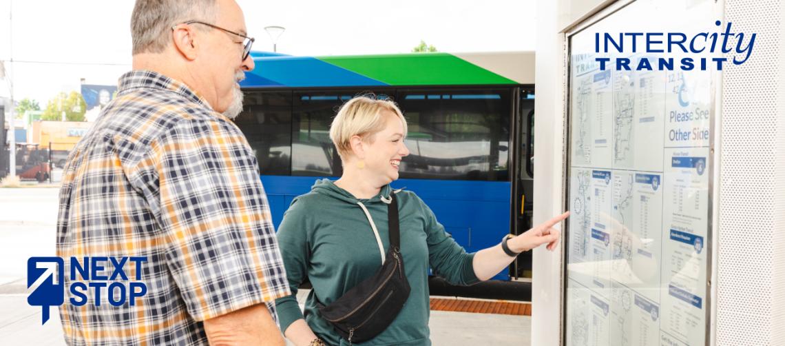 Man and women looking at schedules at a transit center