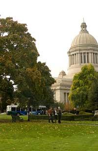 Washington State Capitol building, people walking, and an intercity transit bus